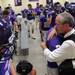 Ann Arbor Pioneer head coach Paul Test singles out a player to embrace after the team's pre-game prayer before the kickoff of it's home game against Birmingham Brother Rice on Thursday, Aug. 30. Chris Asadian | AnnArbor.com